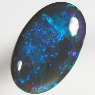 SOLID BLACK OPAL Bright electric peacock coloured roling flashes 
